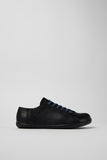 Side view of Peu black leather men’s shoes on a white background.