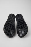 Bottom view of Peu men’s shoes showing textured TPU outsole on a white background.