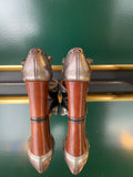 Chie Mihara KINTA heels viewed from the back with a brown block heel and silver-effect leather finish