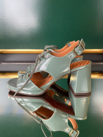 Chie Mihara OCHAN heeled sandals in glossy sage green leather with lace-up front, slingback strap and block heel