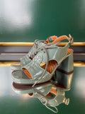 Chie Mihara OCHAN sandals shown at an angle in sage green leather with woven front detail, lace-up fastening and platform sole