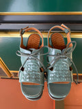 Chie Mihara OCHAN sandals viewed from above with glossy sage green leather, woven detail, lace-up front and slingback buckle