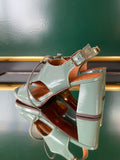 Chie Mihara OCHAN sandals shown from the rear angle with a sage green block heel and adjustable slingback strap