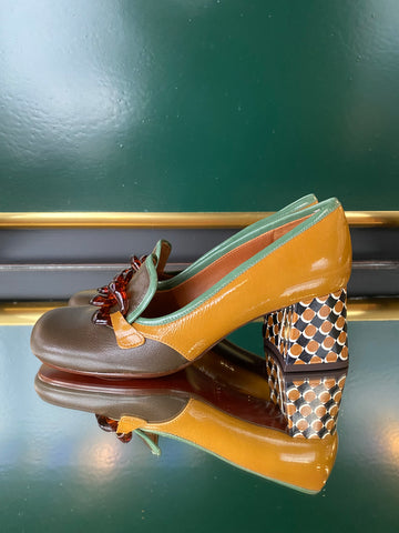 Chie Mihara MUFINI heels in olive taupe leather with mustard yellow patent detail, mint trim and a patterned block heel