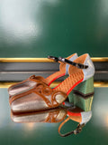 Chie Mihara VYCOLA Silver Multi heels shown at an angle with metallic silver leather, brown patent trim, black ankle strap and green heel