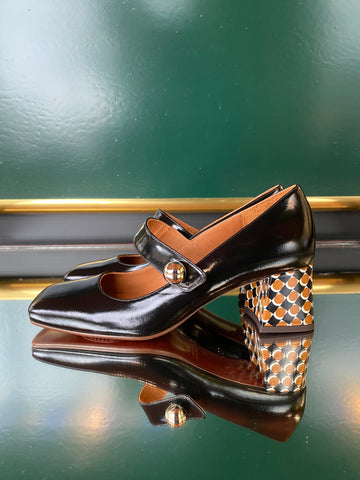 Chie Mihara VYKAR Black Mary Jane heels in glossy black leather with a patterned heel in brown, black and white