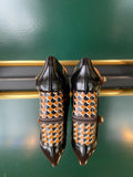 Chie Mihara VYKAR Black heels viewed from the back with a wide patterned heel and glossy black leather finish