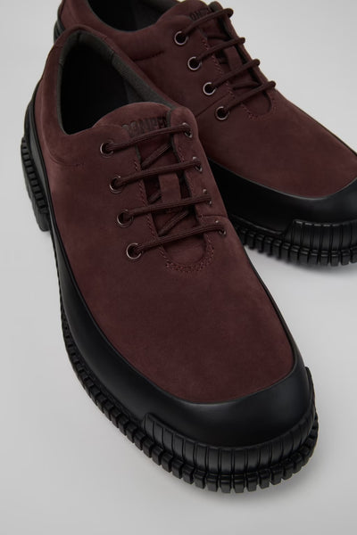 Angled close-up of Pix multicolor nubuck and leather shoes showing texture and stitching on a white background