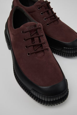 Angled close-up of Pix multicolor nubuck and leather shoes showing texture and stitching on a white background