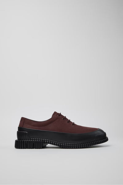 Profile view of burgundy and black leather men’s shoes showing textured EXTRALIGHT outsole on a white background.