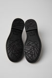 Bottom view of Dean black leather men’s shoes showing XL EXTRALIGHT outsole pattern on a white background.