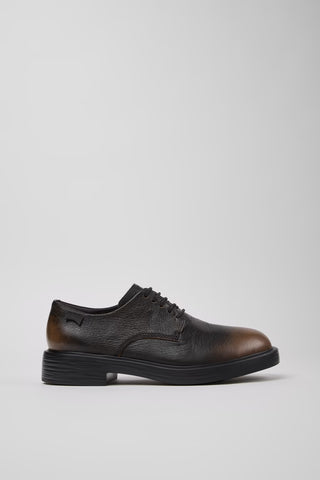 Side view of Dean multicolor black and brown leather men’s shoes on a white background