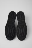 Bottom view of Norman green suede men’s shoes showing EXTRALIGHT outsole pattern on a white background