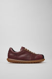 Side view of Pelotas multicolor calfskin leather men’s shoes on a white background.