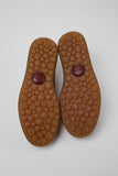 Bottom view of Pelotas men’s shoes showing the 87-sphere rubber outsole pattern on a white background.