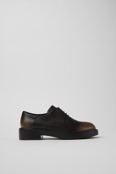 Side view of Dean brown and black calfskin leather shoes showing clean silhouette and lightweight EXTRALIGHT® outsole.