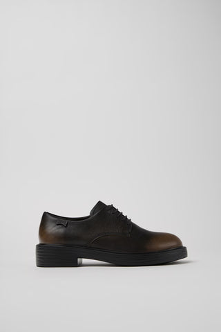 Side view of Dean brown and black calfskin leather shoes showing clean silhouette and lightweight EXTRALIGHT® outsole.