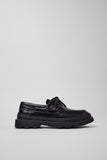 Side view of Brutus+ black calfskin leather shoes for women with elevated Bridge® XTRAGRIP outsole and EVA midsole