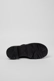 Sole view of Camper Milah black calfskin leather shoes from Kron highlighting the chunky 5.4 cm profile and lightweight EVA outsole for grip and comfort.