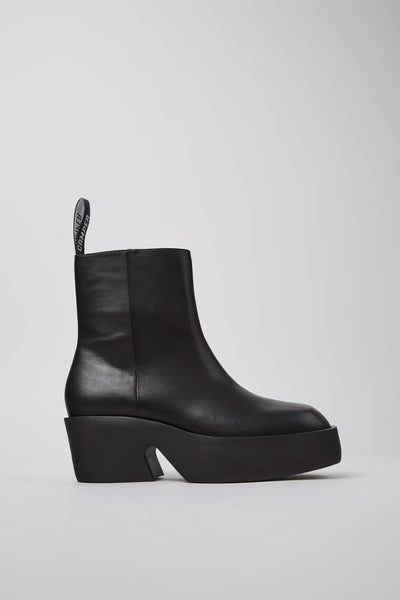 Side view of Billie black calfskin leather mid boots for women with sculptural heel and EVA sole.