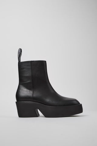 Side view of Billie black calfskin leather mid boots for women with sculptural heel and EVA sole.