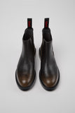 Top view of Camper Dean brown leather ankle boots from Kron showing the smooth calfskin finish and clean, structured shape.