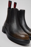 Angled view of Camper Dean brown leather ankle boots from Kron highlighting the smooth calfskin finish and lightweight XL EXTRALIGHT® sole.