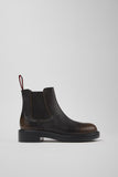 Side view of Camper Dean brown leather ankle boots from Kron showing the sleek minimalist shape and lightweight XL EXTRALIGHT® sole.