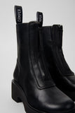 Black leather boots with zippers on a white background