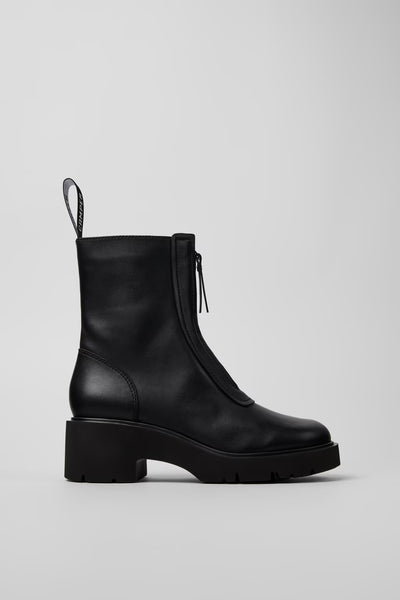 Black leather boot on a light gray background