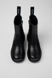 Top view of Camper Thelma II black leather ankle boot on a plain background.