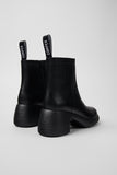 Back view of Camper Thelma II black leather ankle boot highlighting the heel and platform shape
