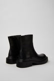 Back view of Camper Pix Berlin black leather mid boot showing heel and stitching detail on a white background.