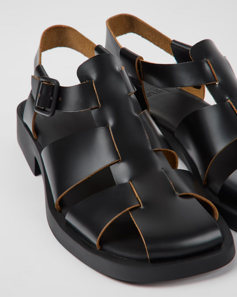 Angled
Camper Dana black leather sandals for women shown at an angle with a minimal strappy design and flat sole