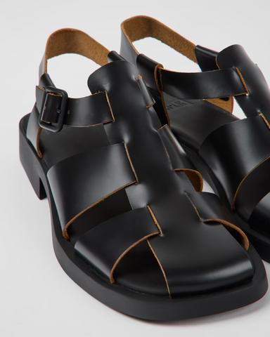 Angled
Camper Dana black leather sandals for women shown at an angle with a minimal strappy design and flat sole