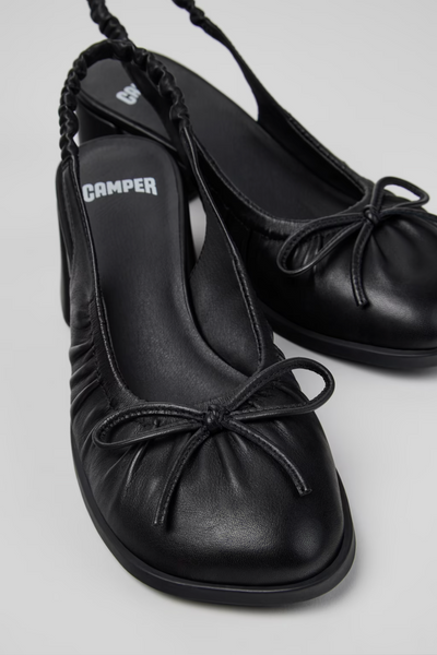 Kora black semi-open leather shoes for women with bow detail and low heel
