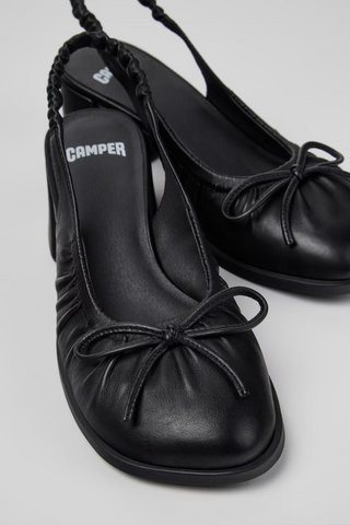 Kora black semi-open leather shoes for women with bow detail and low heel