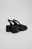 Back view of Kora black semi-open leather shoes with slingback strap