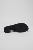 Back view of Kora black semi-open leather shoes with slingback strap