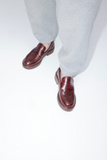 Twins brown leather loafers styled with grey trousers