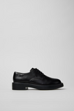 Side view of Dean black leather shoe with lightweight EVA outsole