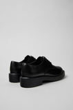 Back view of Dean black leather shoes with chunky black sole