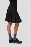 Dean black leather shoes styled with grey socks and black dress