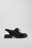 Side view of Donna black semi-open leather shoe with low heel