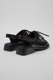 Back view of Donna black semi-open leather shoes with open heel design