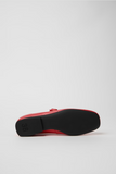 Outsole detail of Casi Myra red leather ballerina with black TPU sole