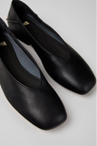 Close-up of Casi Myra black leather ballerinas with slightly square toe