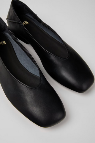 Close-up of Casi Myra black leather ballerinas with slightly square toe