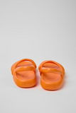 Back view of Camper Kobarah Flat orange sandals with rounded strap design