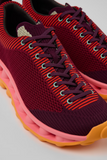 Close-up of Camper x SUNNEI PELOTISSIMA sneakers in burgundy, pink and orange with lace-up detail